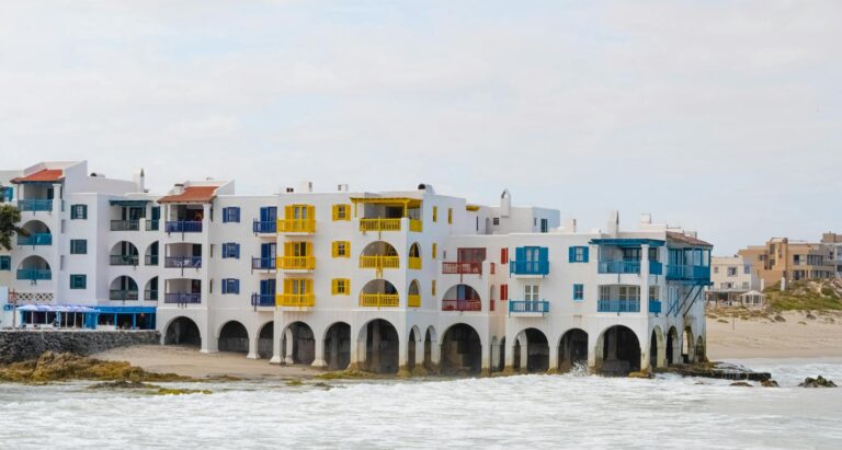 Scenic view of vibrant buildings along the shoreline in Langebaan, South Africa.